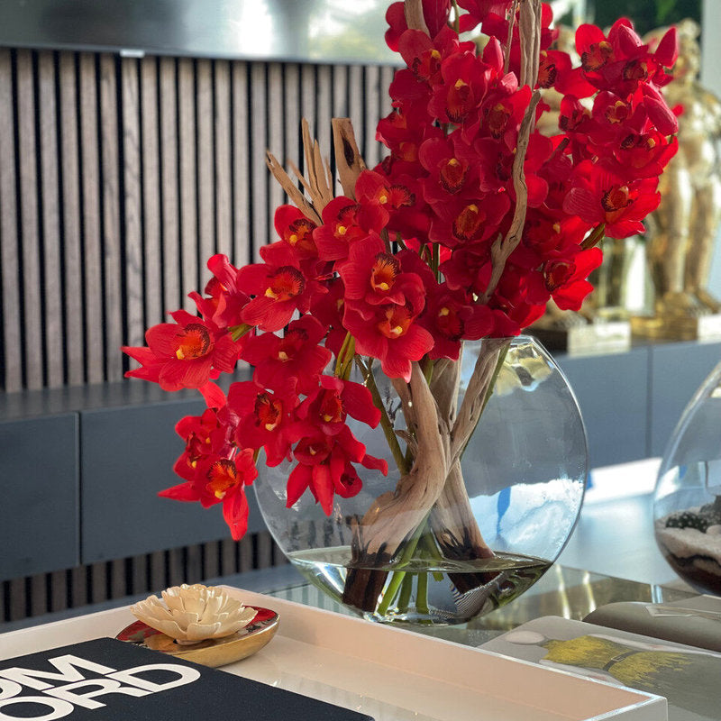 Cymbidiums Rouges Dans Un Vase Lune